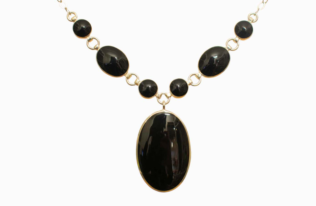 Juego de collar, aretes y pulsera de plata con piedra natural