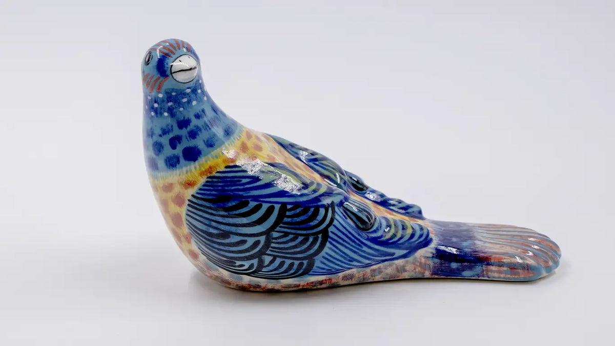 Pájaro picotero azul de cerámica