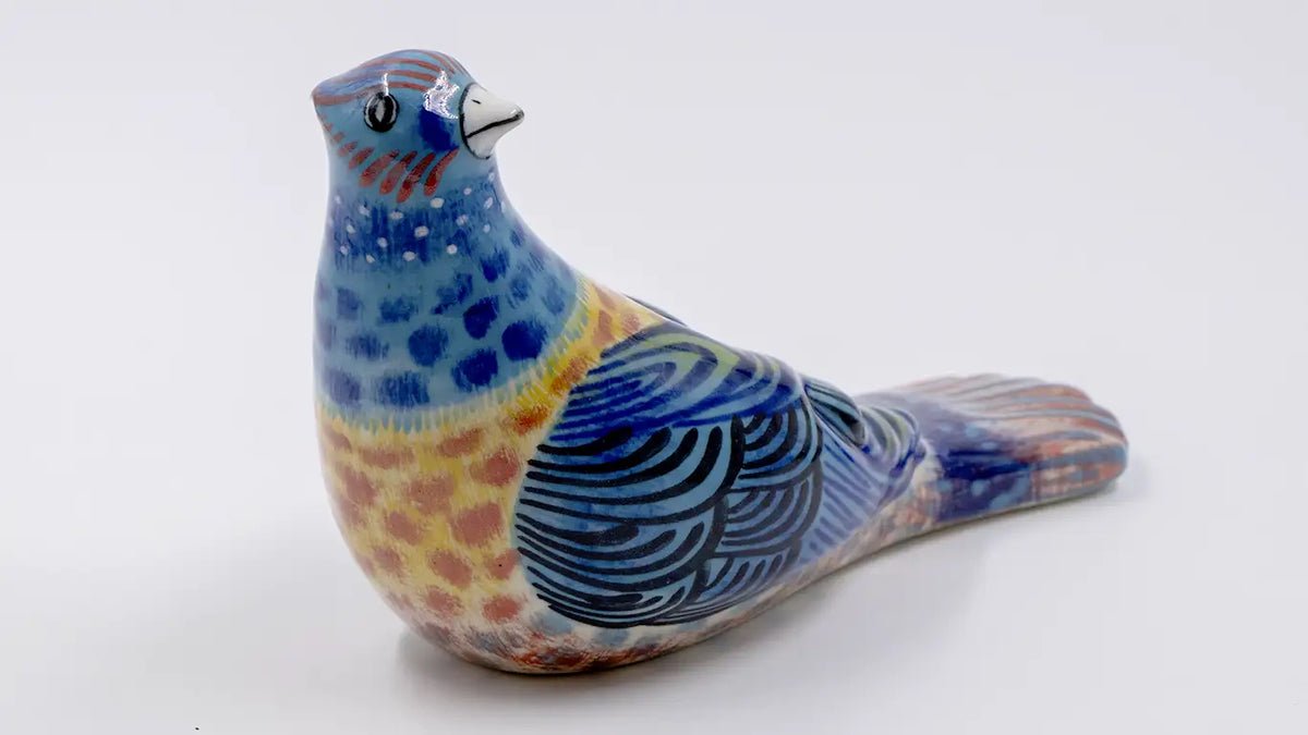 Pájaro picotero azul de cerámica