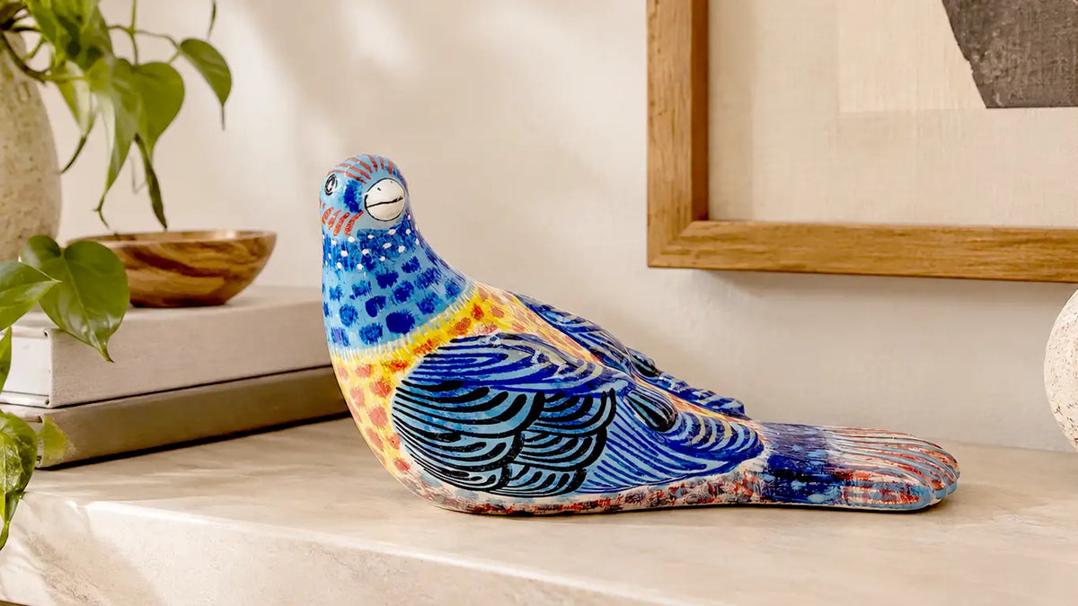 Pájaro picotero azul de cerámica