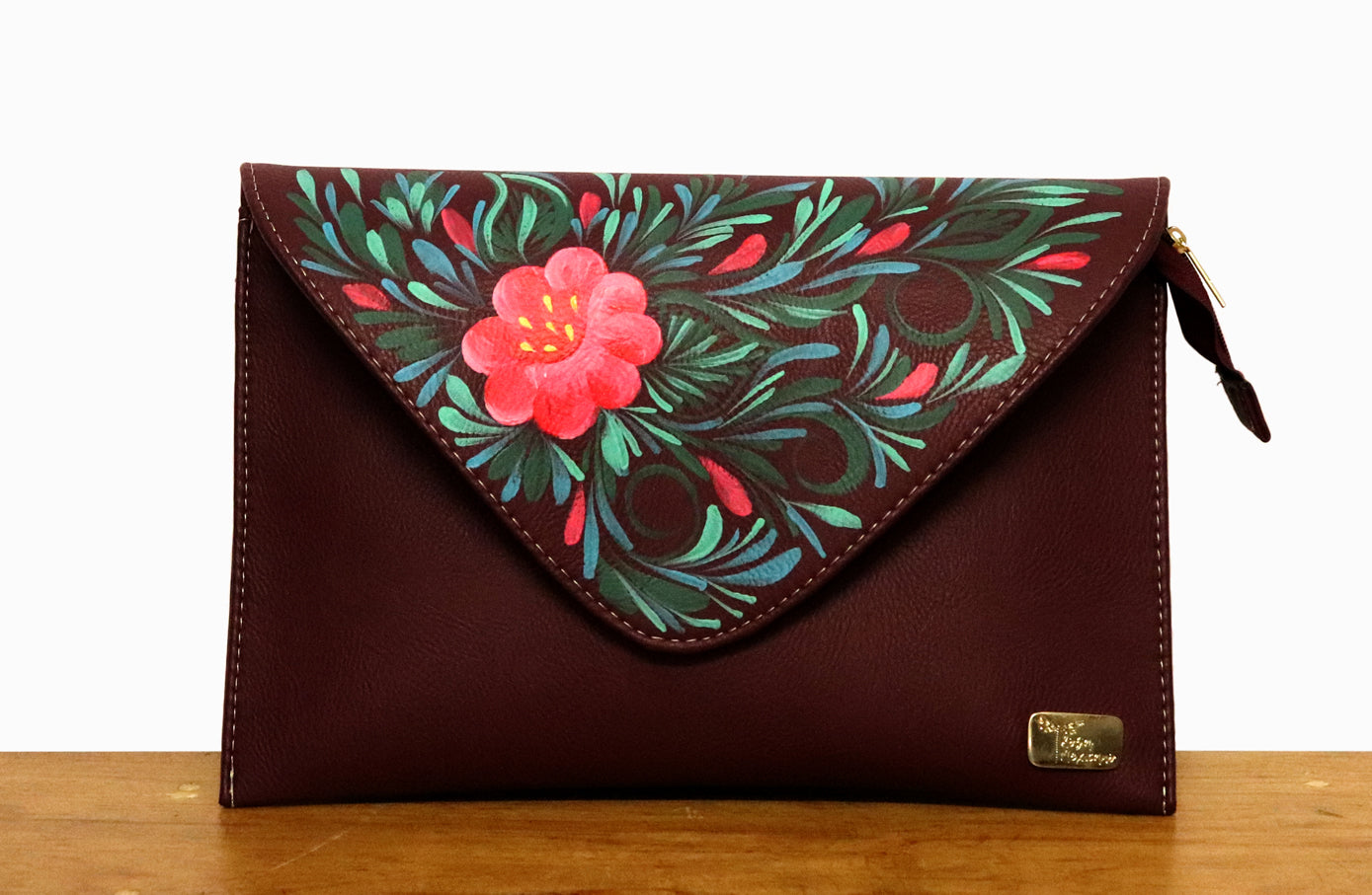 Bolsa clutch decorada